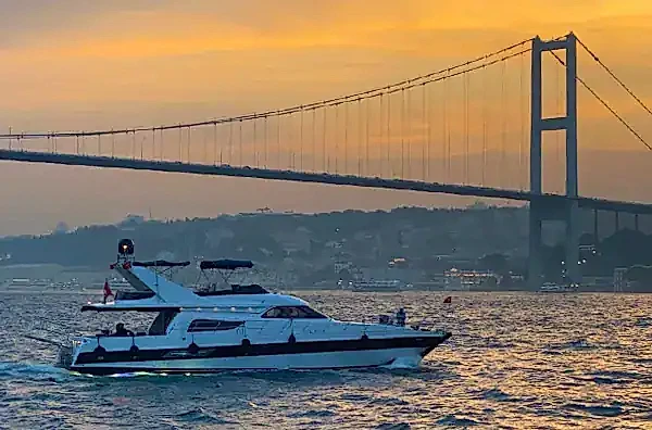Image of a Bosphorus cruise boat at Istanbul sunset time in Turkey